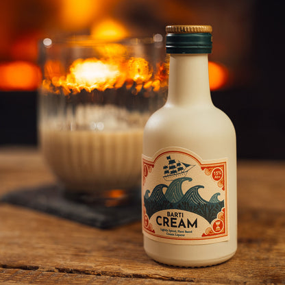 Best Cream Liqueur miniature 5cl bottle on a table with best cream liqueur in a glass