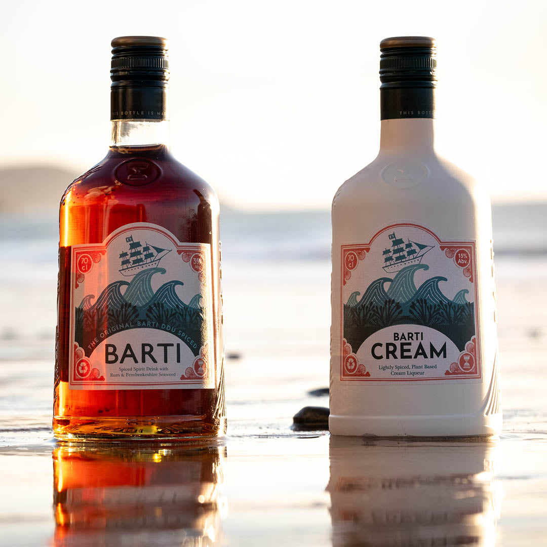 Barti Latte Cocktail made with Best Spiced Rum and Cream Liqueur cocktail duo set on the beach