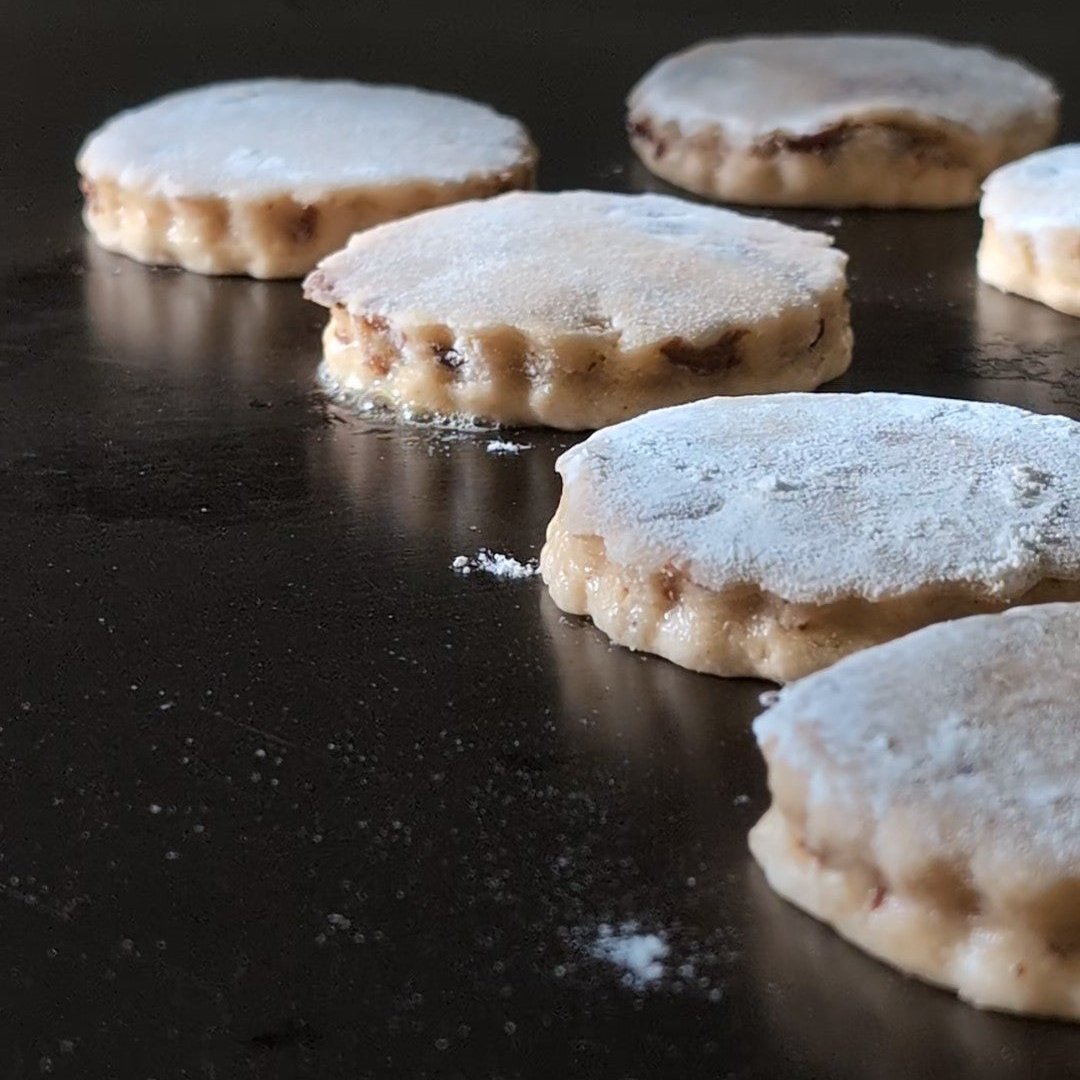 Welshcakes cooking on hot griddle